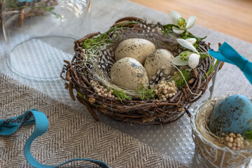 Easter wreath with a birdhouse and eggs