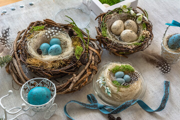 Easter wreath with a birdhouse and eggs