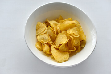 Yellow beautiful delicious chips in a plate