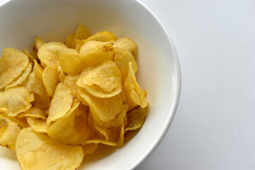 Yellow beautiful delicious chips in a plate
