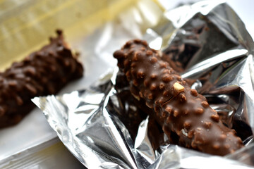 Delicious chocolate bar with nuts in a package