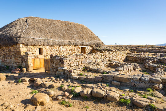 Reconstruction of a Celtiberian house made of stone and straw at Numancia archaeological site, Garray, province of Soria, Castile and Leon, Spain