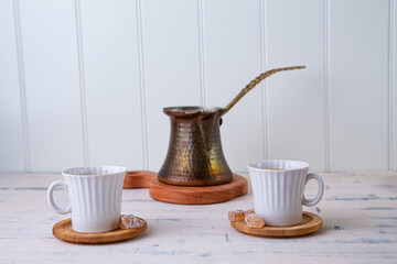 coffee pot with 2 cup on light background