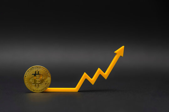 Cryptocurrency price. Fluctuations and forecasting of the cryptocurrency rate. Bitcoin coin on the price chart points up. on black background, copy space