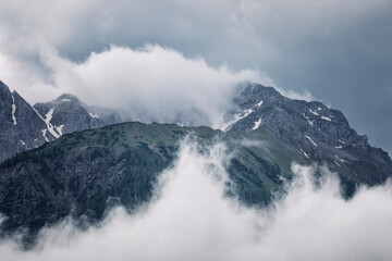 fog and clouds around mountain top
