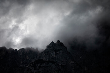 dark couds around mountain peak
