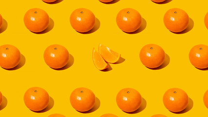 Fresh citrus Seamles fine pattern. Ripe fruit tangerines. Trendy sunlight Summer,spring pattern made with mandarine slice on bright light orange background. Minimal summer concept. MonochromaticBanner