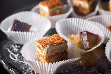 Sponge cake in paper cups on a tray.