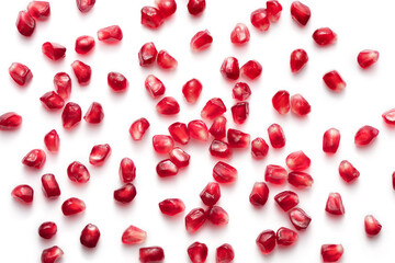 red pomegranate seeds on white background