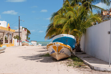 Boats on a sandy road beside the sea. This is a common scene when the fishermen are not able to go...