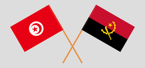 Crossed flags of Tunisia and Angola. Official colors. Correct proportion