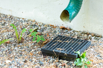 Storm sewer with grate. Rainwater drainage into the grate. How to make the drainage of the site and the drainage of water