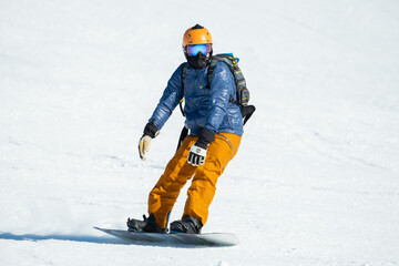 Fototapeta na wymiar Man on Snowboard