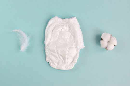 Baby diaper on a blue background. with copy space. Hygiene and child care. Soft comfortable cotton panties. top view. lat lay