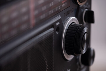 Front panel of the radio with buttons, tuner and radio waves