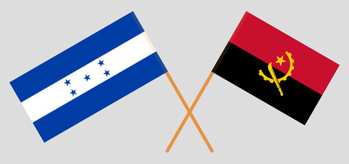 Crossed flags of Honduras and Angola. Official colors. Correct proportion