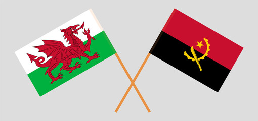 Crossed flags of Wales and Angola. Official colors. Correct proportion