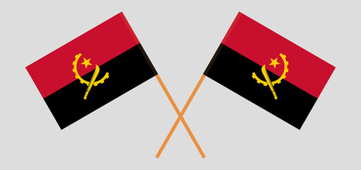 Crossed flags of Angola. Official colors. Correct proportion