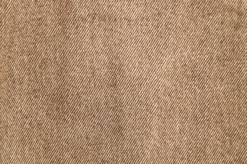 fabric grunge background, real cotton denim brown, wrinkled, frayed, close
