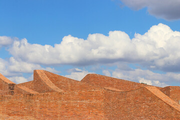 Fototapeta na wymiar architecture brick wall with sky background