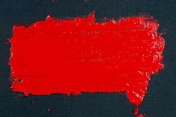 abstract creative background: red spots, strokes and splashes of colored primer when toning a black...