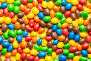 Fototapeta na wymiar colored crunchy chocolate balls occupying the entire image