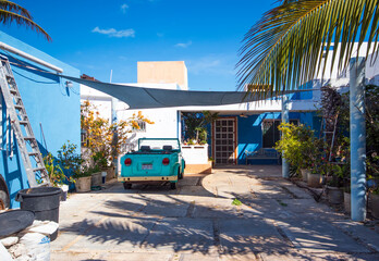 Cute blue house - bright homes and cars in southern countries