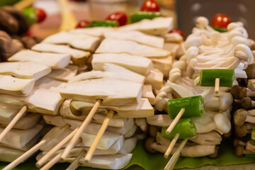 eringi mushrooms on wooden skewers fast food asia