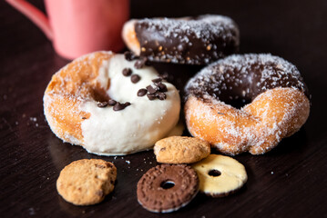 Having breakfast filled with chocolate and caramel donalds, white chocolate cream, and some cookies. 