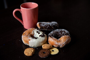 Having breakfast filled with chocolate and caramel donalds, white chocolate cream, and some cookies. 