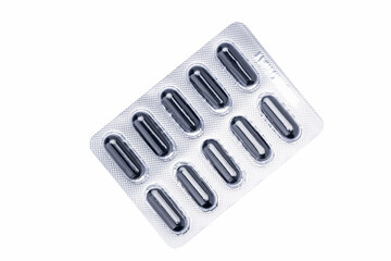 pill blister pack isolated on a white background. drug package cut out. black tablets stack