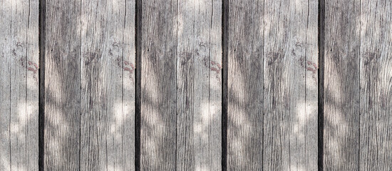 gray faded boards in sunlight vertical stripes background