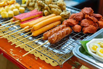 street food thailand market assorted barbecue sausages and pieces of meat selective focus