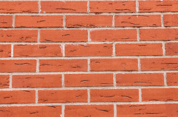 brick wall red grunge background with gray lines joints