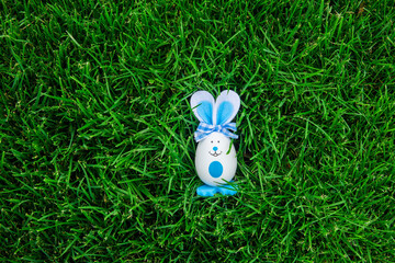 easter bunny with eggs on the grass