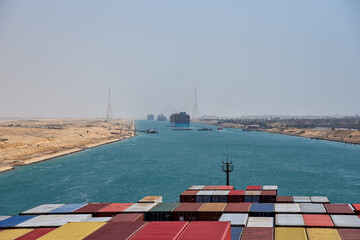 View on the containers loaded on deck of cargo ship. Vessel is transiting Suez Canal on her...