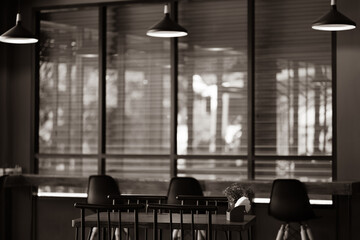 Dark room with tables, chairs, light bulbs.
