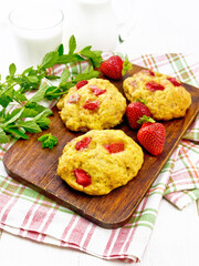 Scones with strawberry on white board