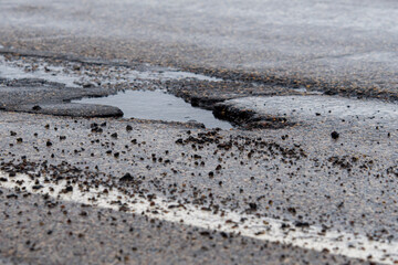 Fototapeta na wymiar Spring Potholes and Puddles