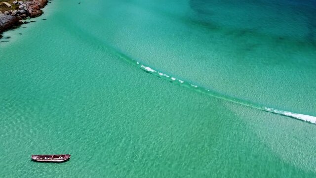 Caribbean beach view of boat in Regiao dos Lagos, Rio de Janeiro, Brazil.Caribbean beach view of boat in Regiao dos Lagos, Rio de Janeiro, Brazil.Caribbean beach view of boat in Regiao dos Lagos.
