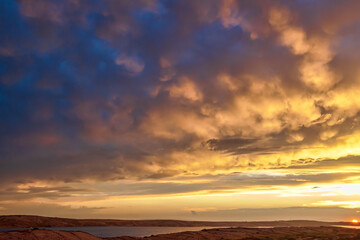 Fototapeta premium Sunset is full of colours over the rugged Island of Pag, Croatia.