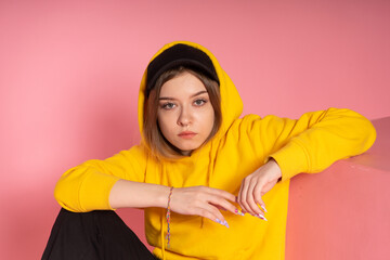 Sad LGBT woman sits on the floor