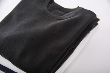 Pile of sweater and tshirt on white background