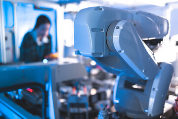 Meeting asian Engineers Maintenance Robot Arm at Lab. they are in a High Tech Research Laboratory with Modern Equipment. Technology and Innovation Concept.Professional .