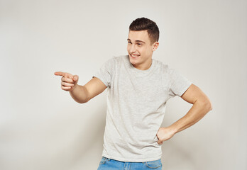 Handsome man in t-shirt and jeans fashionable clothes cropped view