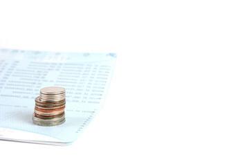 Passbook and coin on the white background.
