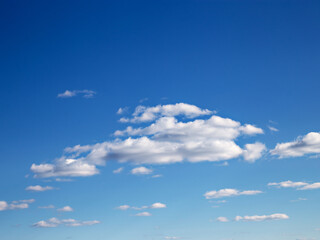 White clouds in blue skies on sunny spring day