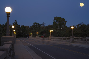 La Loma Bridge over the Arroyo Seco and Worm moon rising in Pasadena, California.