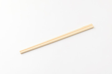 Disposable wooden chopsticks on a white background