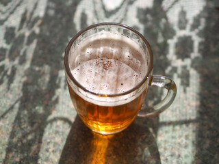 Old Soviet beer mug with beer.